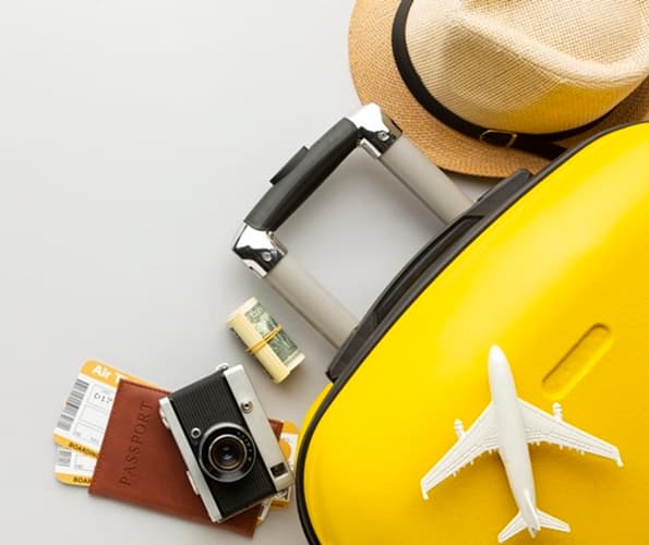 Flat lay yellow luggage with copy space 0