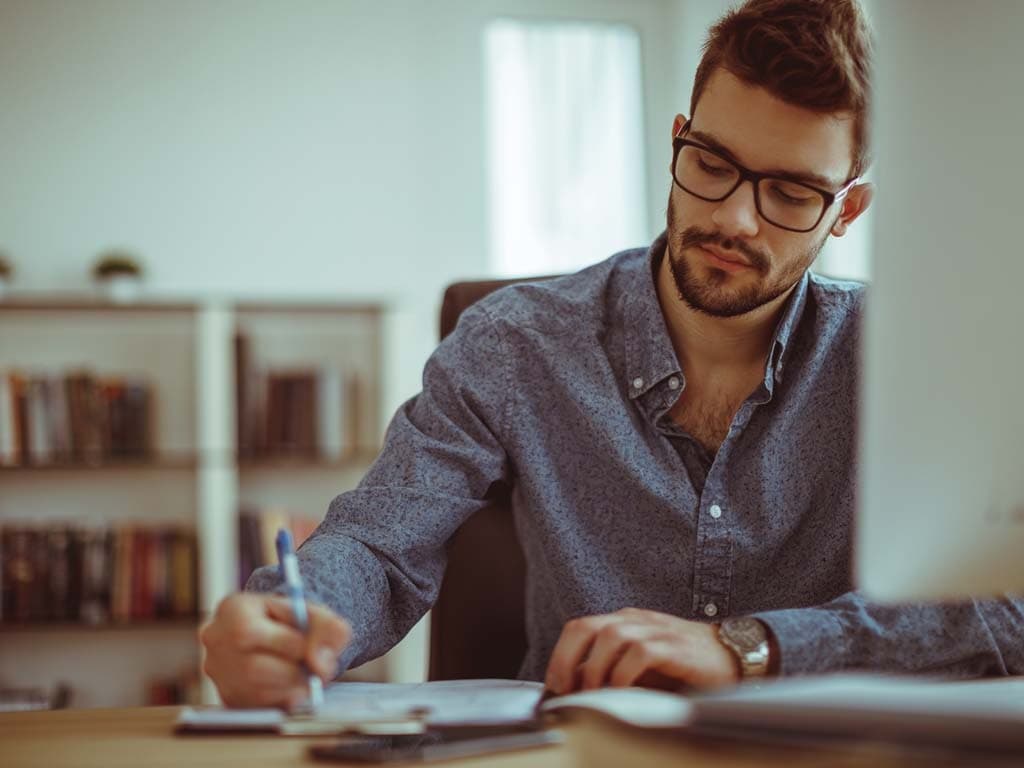 man working in his home office