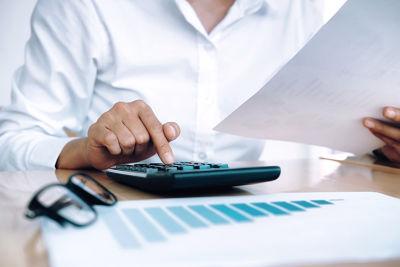Finances saving economy concept female accountant banker use calculator opt